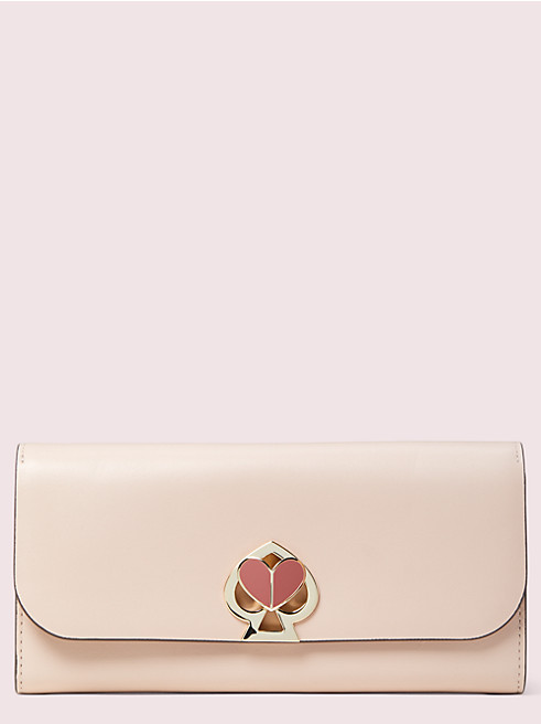 Kate Spadeのかわいいピンク財布は二コラ ツイストロック です